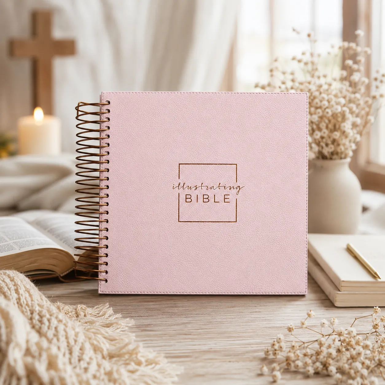 Illustrating Bible beside an open book